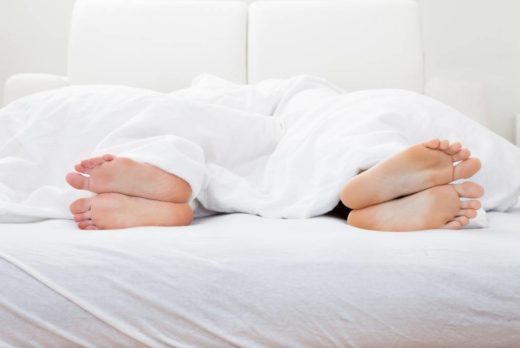 sexless relationship two people in bed facing away from each other