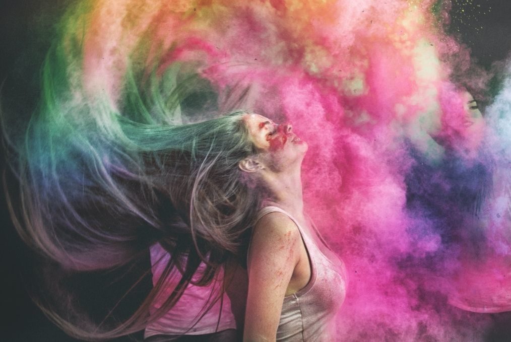 woman throwing her head back exploding in colours infidelity blog