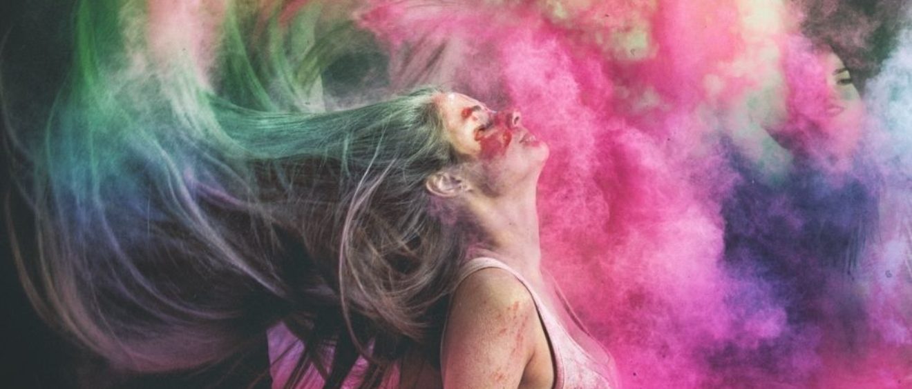 woman throwing her head back exploding in colours infidelity blog
